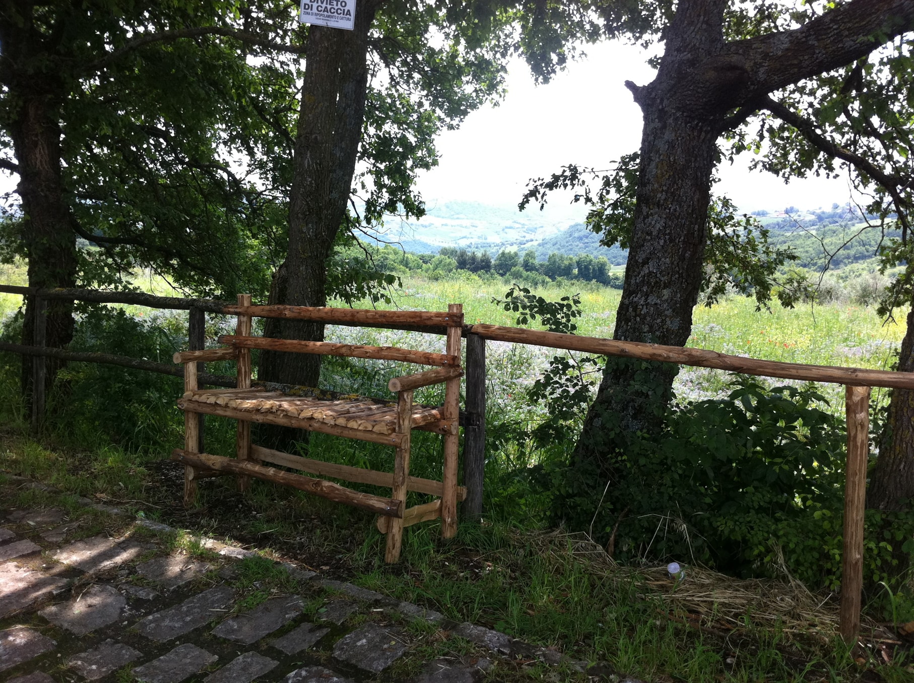 A wooden seat on the Rosary Walk in Pietrelcina