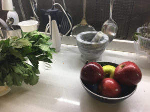 Herbs and apples on the kitchen worktop